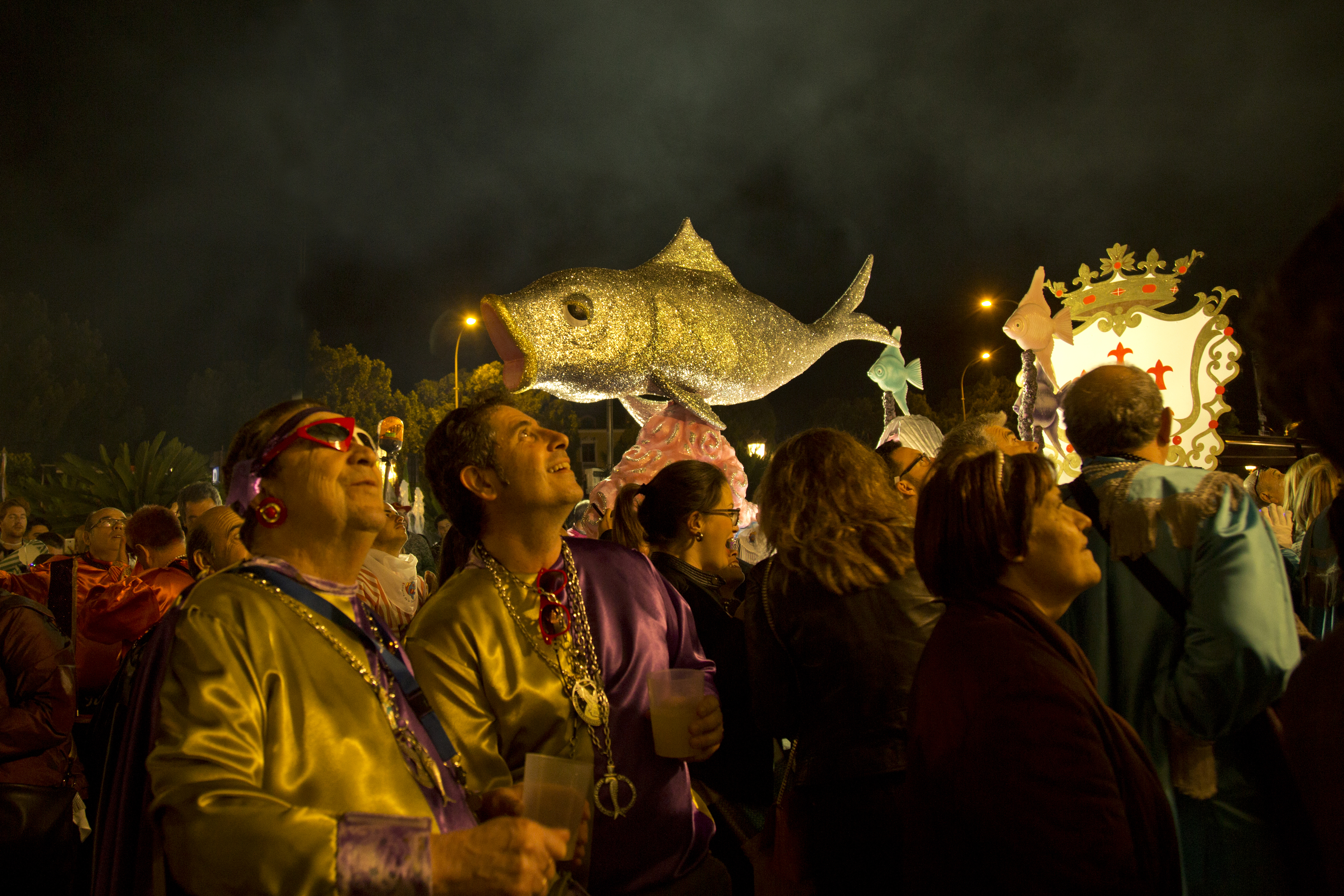 Illuminated sardine float and festival crowds during Entierro de la Sardina, the surreal spring finale to Murcia&rsquo;s Fiestas de Primavera.